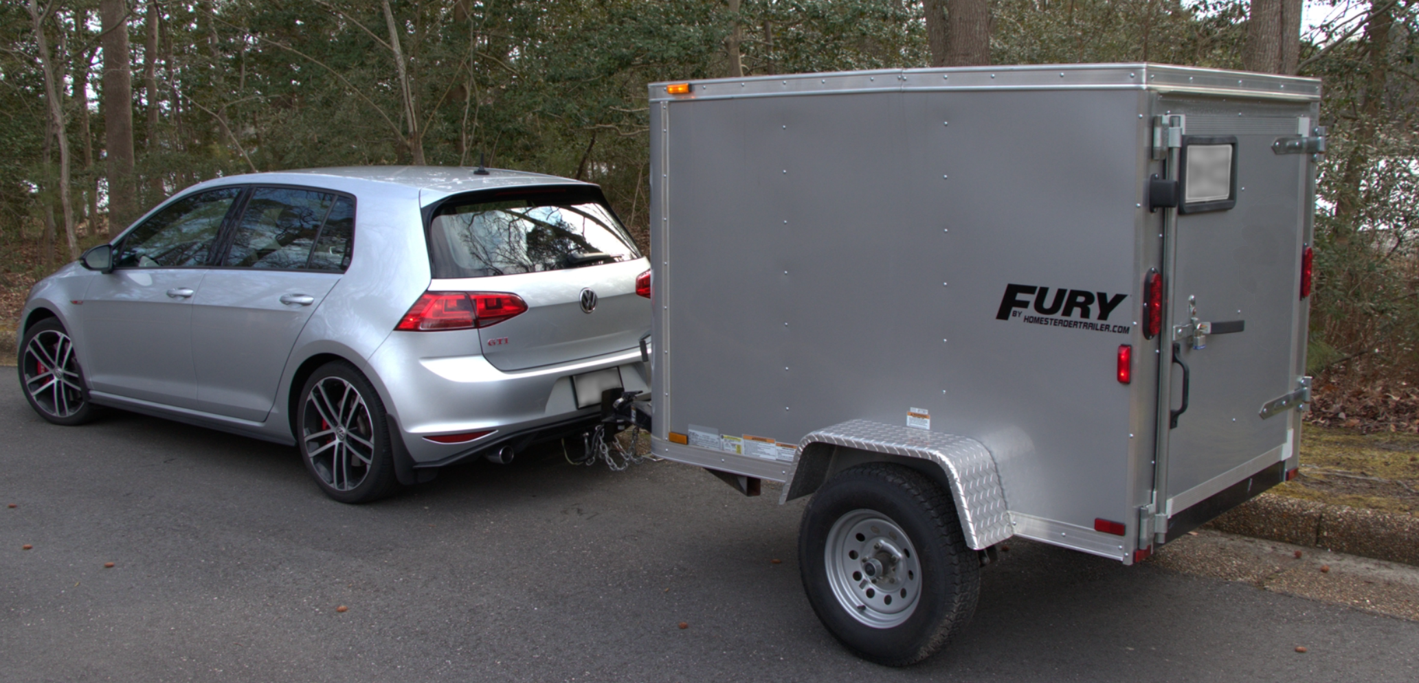 Car towing an enclosed trailer for small item moving in British Columbia